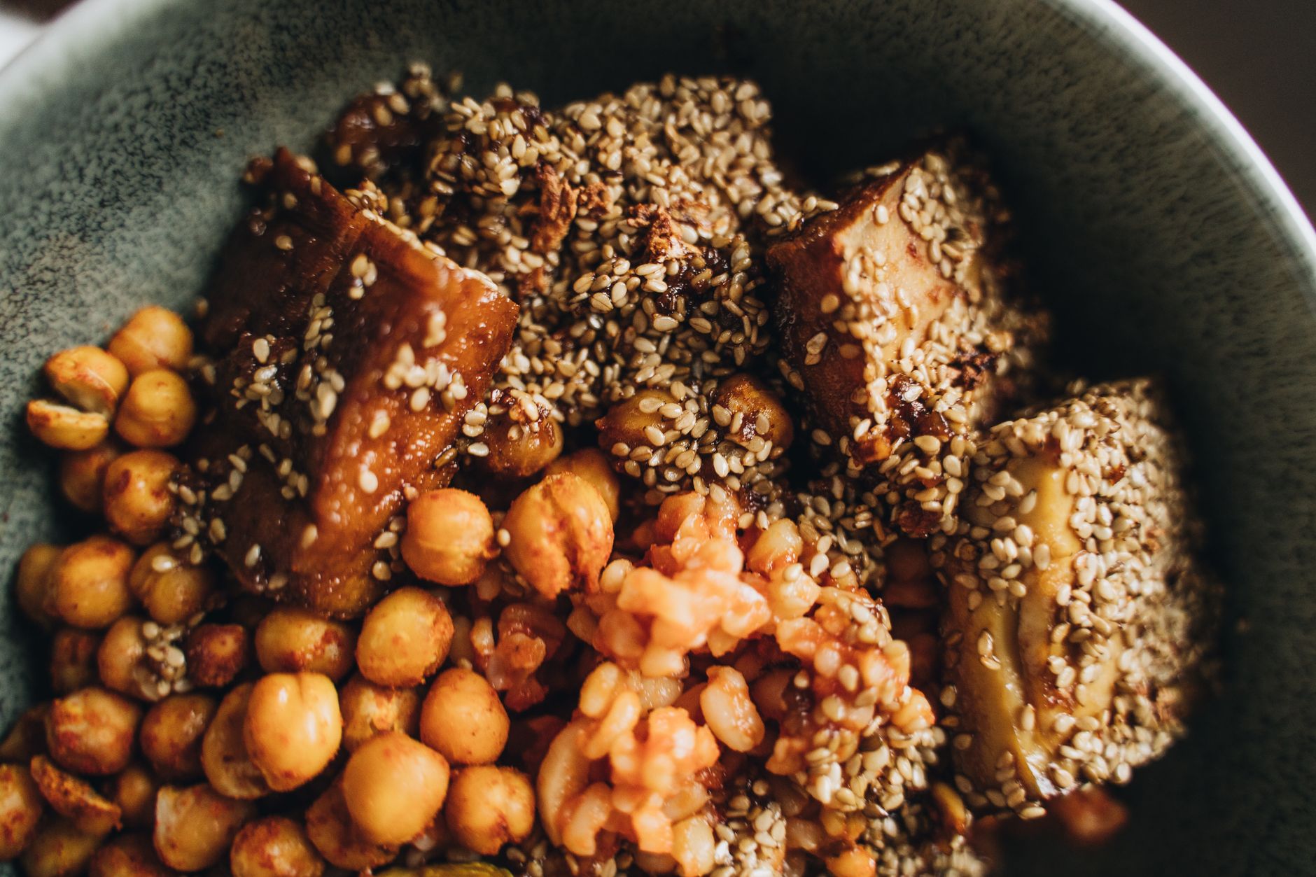 Chickpea grain bowl with kale and tahini drizzle