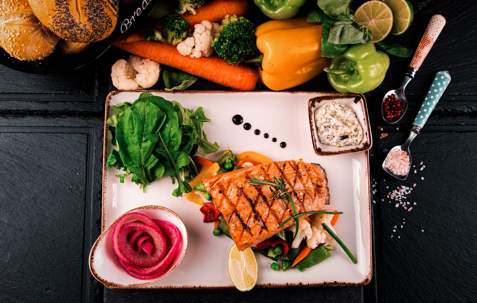 Sheet-pan salmon with seasonal vegetables and lemon